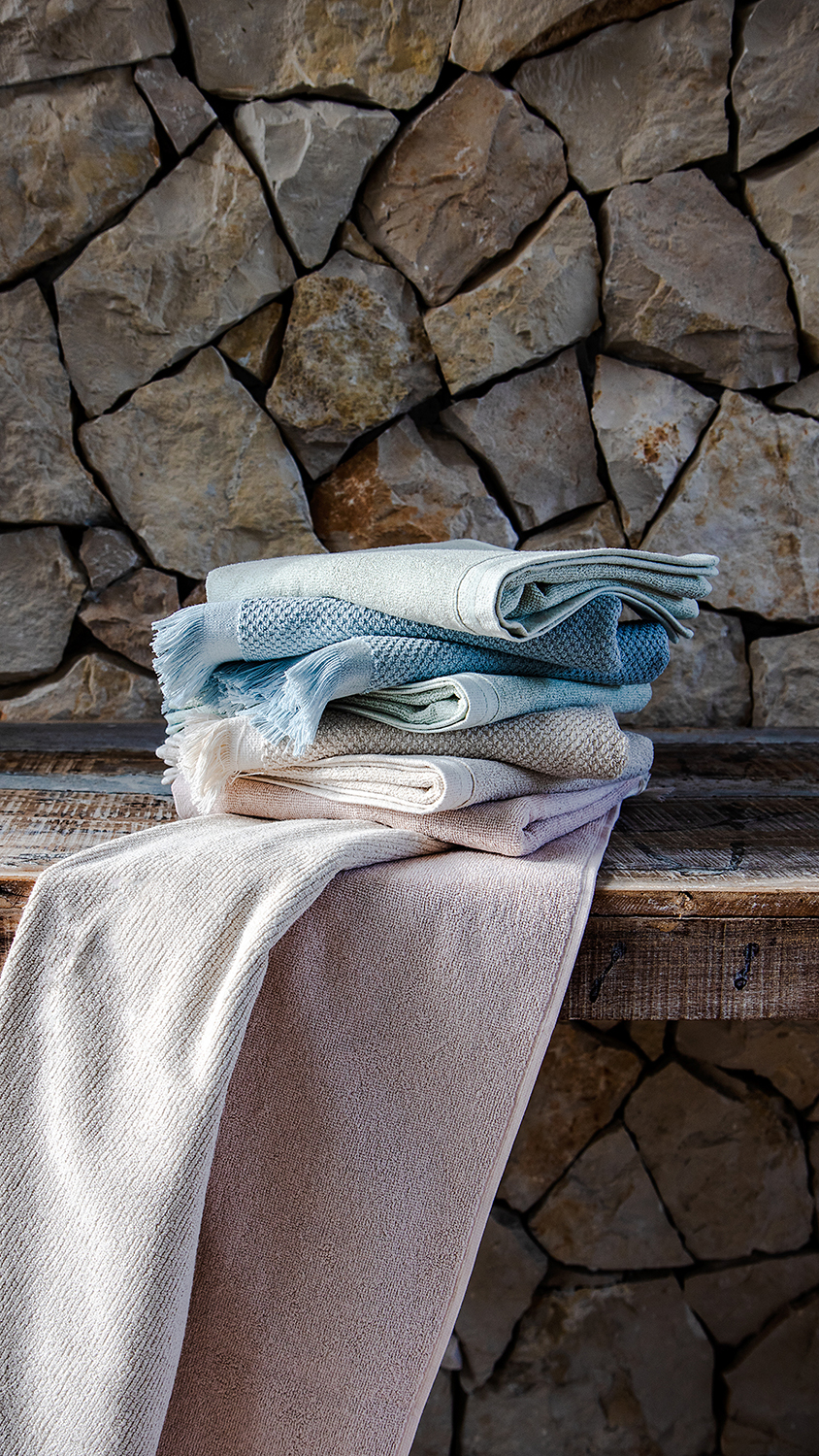 Stack of neatly folded Clarysse bath towels